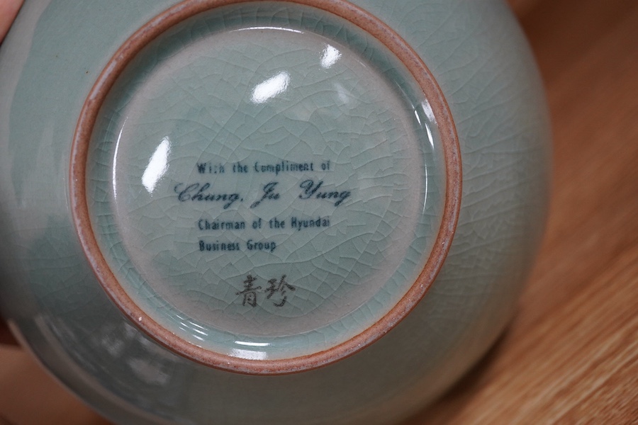 A 20th century Korean celadon crackle glaze vase, base reads ‘With compliment of Chung Ju Yung Chairman of the Hyundai Business Group’, 18.5cm. Condition - good